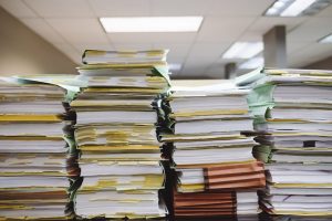 stack of paperwork in an office setting