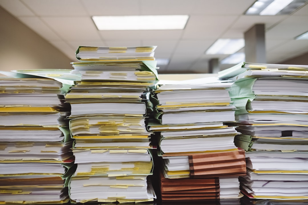 stack of paperwork in an office setting